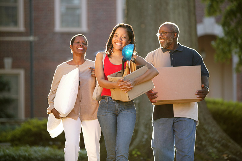 Two parents move their college-age daughter into school.